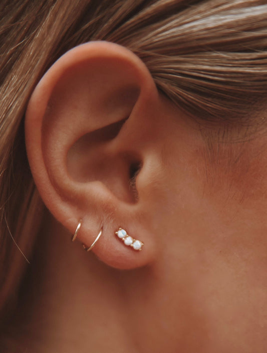 A lovely and vibrant stud earring with prong set opals. Gold vermeil, handmade in the Santa Cruz mountains.