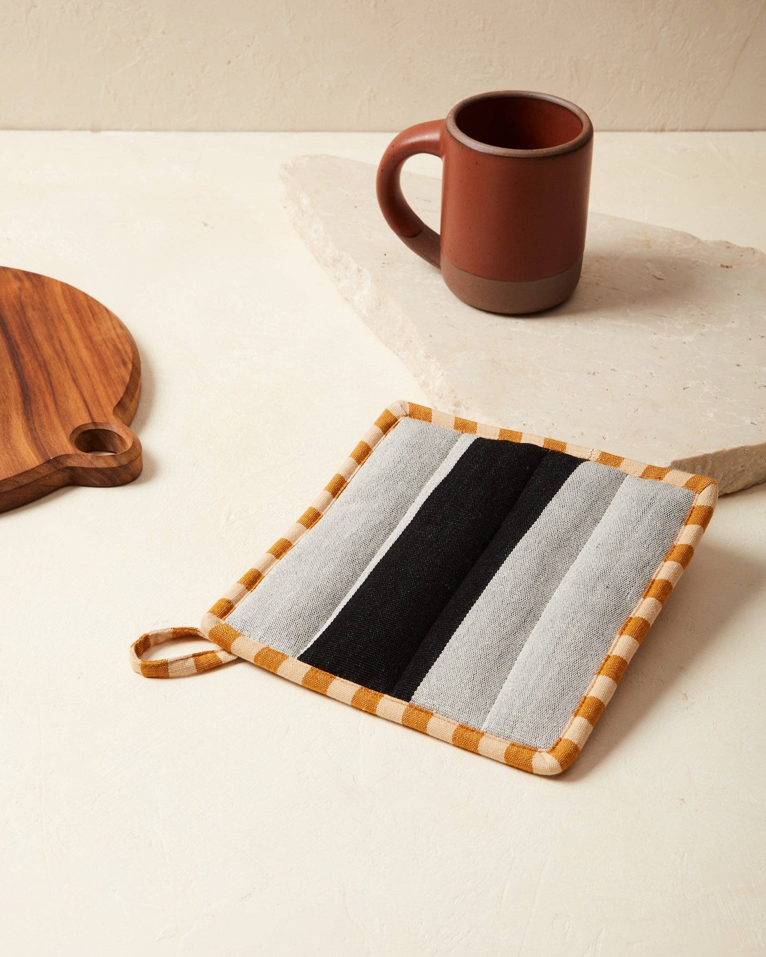 Protect your hands with a hint of style. Designed to be durable & easily incorporated into any home aesthetic: equally attractive in use or hanging in your kitchen by the attached loop.  Handwoven by a family run co-op in Chiapas, Mexico. sol potholder