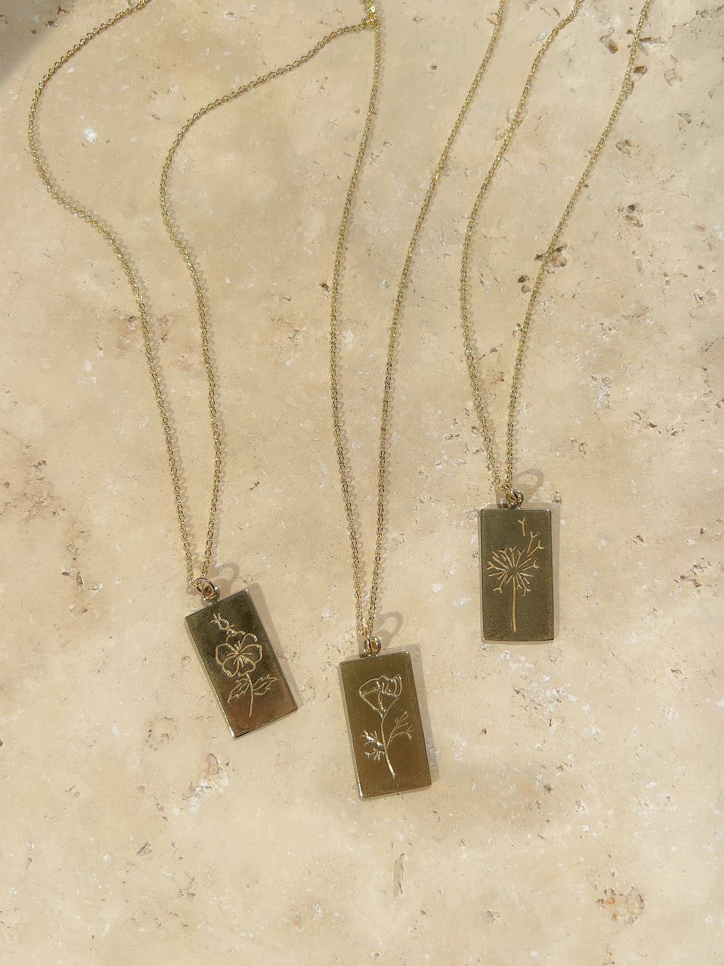 Handmade bronze tarot necklace featuring a wild rose. A tarot card from the plant world to adorn your neck. Hand carved in wax from original drawings by Arwyn Moonrise and sustainably made in northern California by Amanda Hunt.