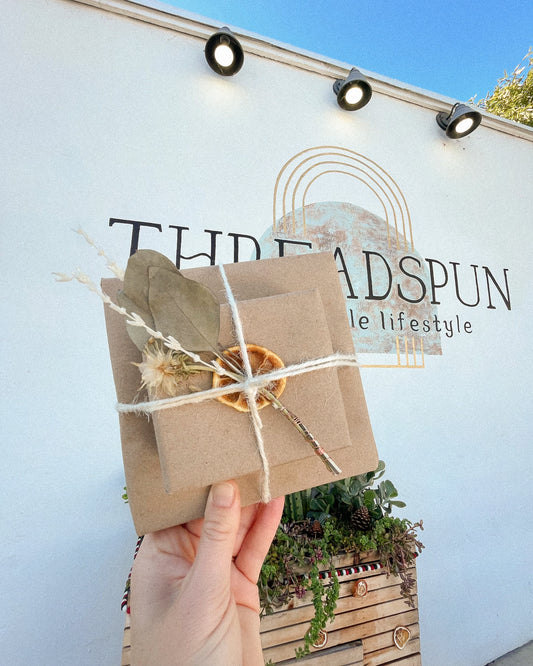 Eco friendly gift wrapping that looks cute to boot and gives you one less thing to have to do. We'll arrange your order in one of our gift boxes (which are made with 100% recycled materials) and finish it off with twine, a dried flower bundle, and a dried orange. 