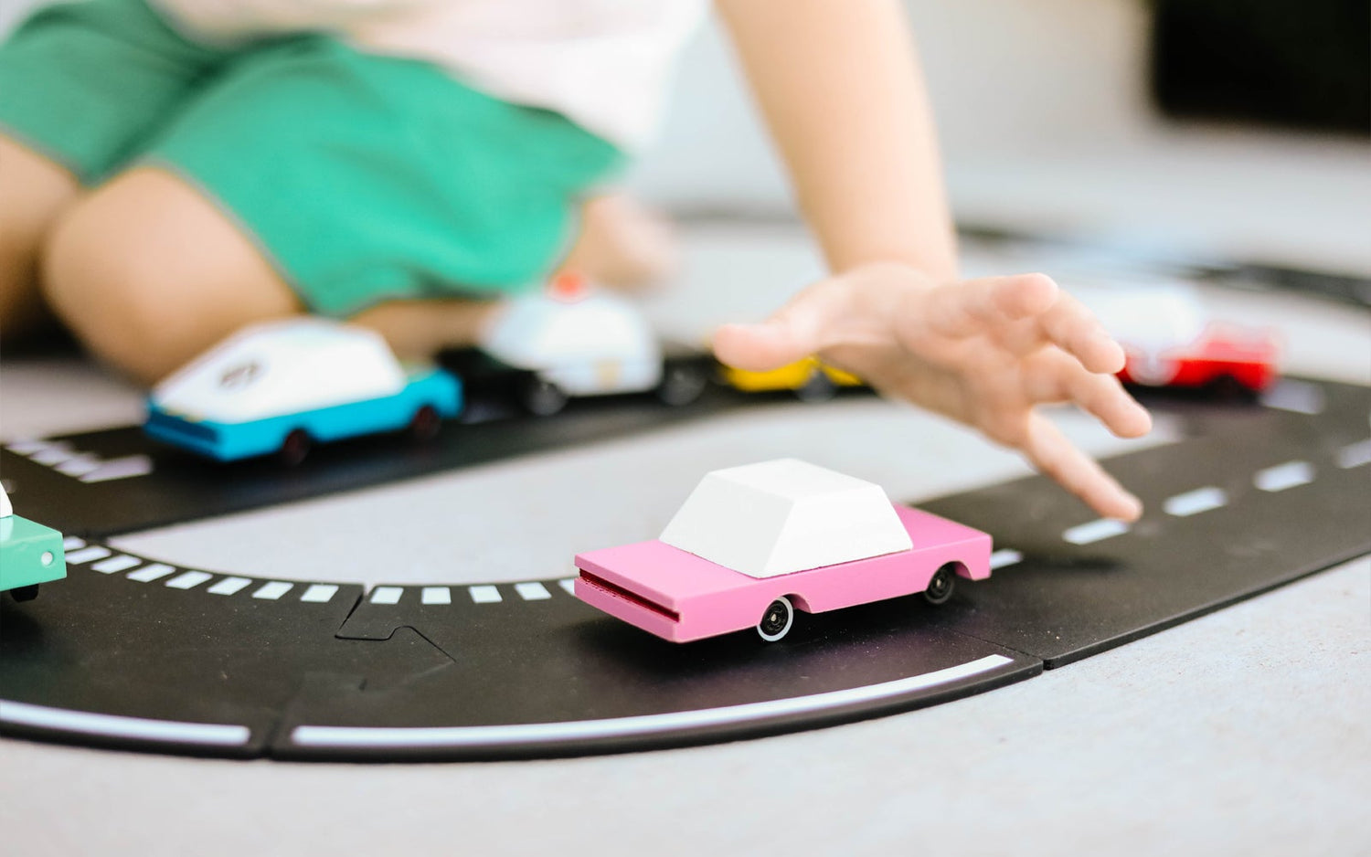 Pink Sedan toy car by Candylab Toys features solid beech wood and water-based paints. Made sustainably, made to last, made for fun. Wood, soy inks, water-based paints, degradable rubber, and metal parts are all part of Candylab's old school way of making toys, with a modern design twist.