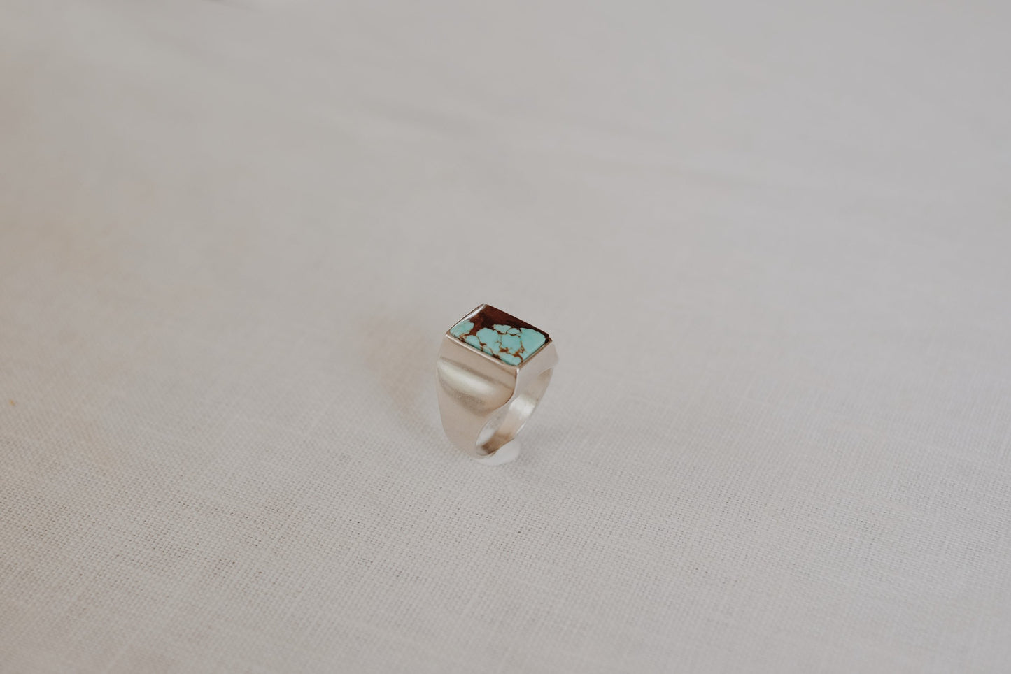 sarah safavi vazquez ring / Chunky, angular and striking like the Vasquez Rocks. A unisex rectangular signet in Sterling Silver featuring #8 Turquoise, a brown and pale blue turquoise found in Arizona.
