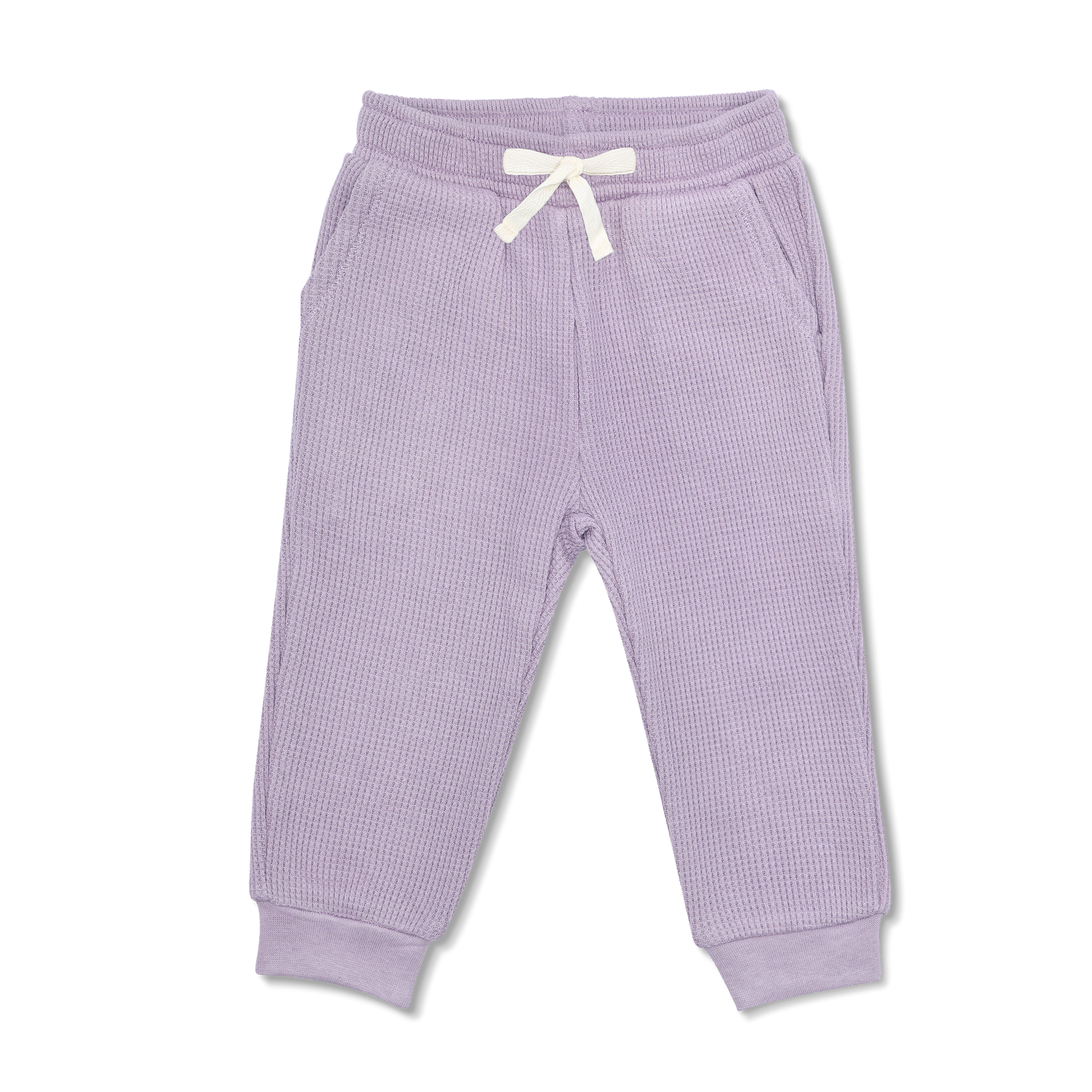 When it's time to play hard, it's time for our comfy joggers. Made from buttery-soft organic cotton, our joggers are extra styling with an elastic waistband and front pockets. A wardrobe staple for kids on the go! Pair with the Waffle Balloon Sleeve Sweater or the Waffle Crew Neck Sweater!
