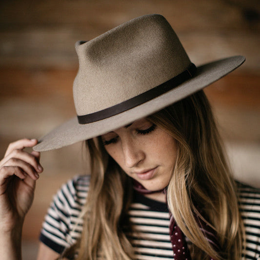 Sustainably made fedora hat with salvaged and recycled materials. This felt fedora hat has a stiff fit and is made with salvaged leather.