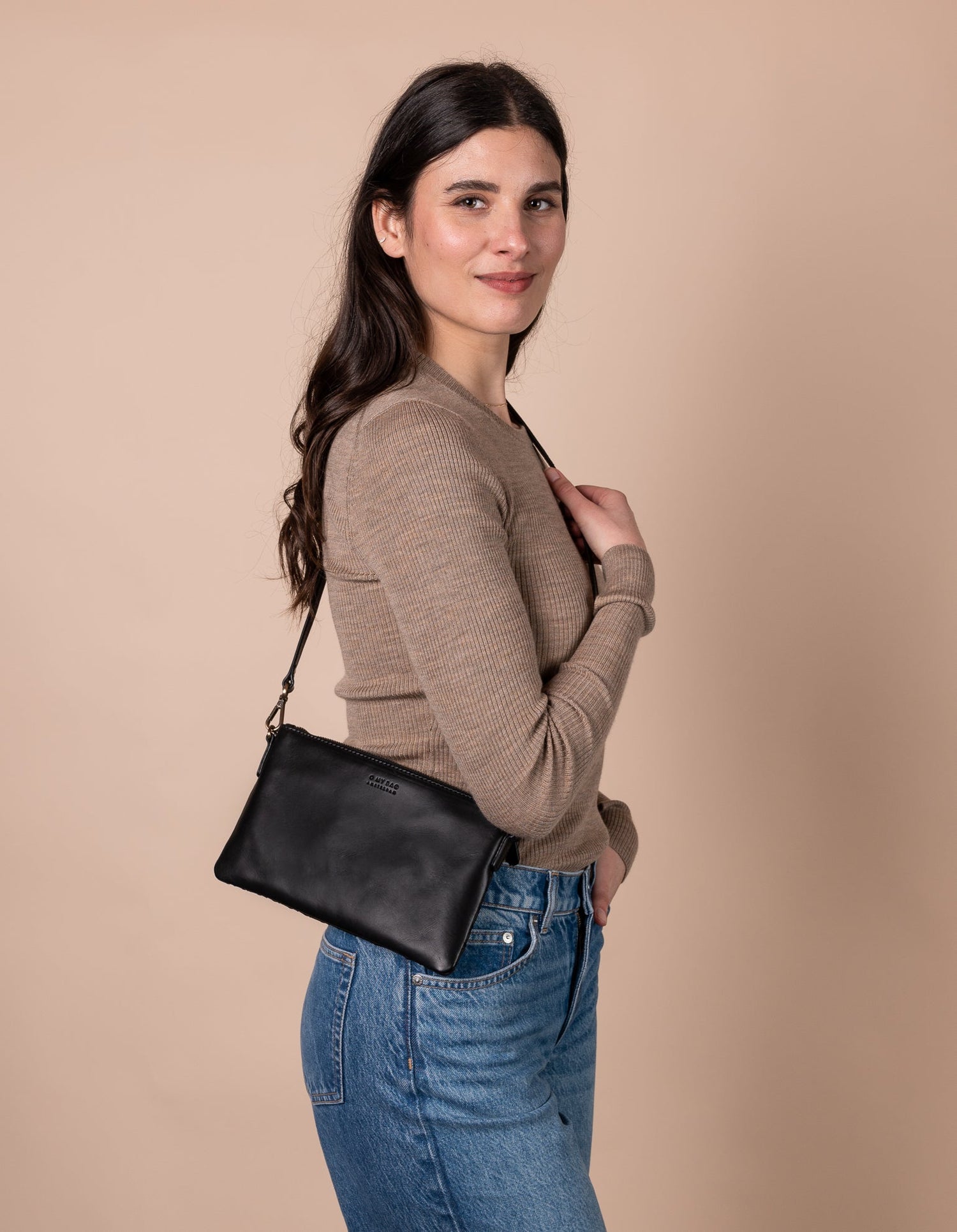 O My Bag Amsterdam Lexi Cross Body Bag: Introducing Lexi, the ultimate wing-woman! This petite woven leather handbag is the perfect cross body bag for all your on-the-go escapades.  Don't let her small size fool you, Lexi is a master of organization with inside pockets for all your essentials like your phone, keys and wallet. Made in India.