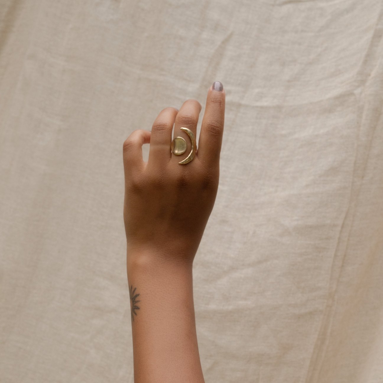 Handmade, yellow bronze equinox ring: a symbol of the balance between the sun & moon, day & night, dark & light. Made sustainably in California by Amanda Hunt.