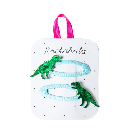 These two glittery dinosaurs on grosgrain ribbon wrapped snap clips are perfect for any dinosaur lover!  Rockahula sold at Thread Spun.