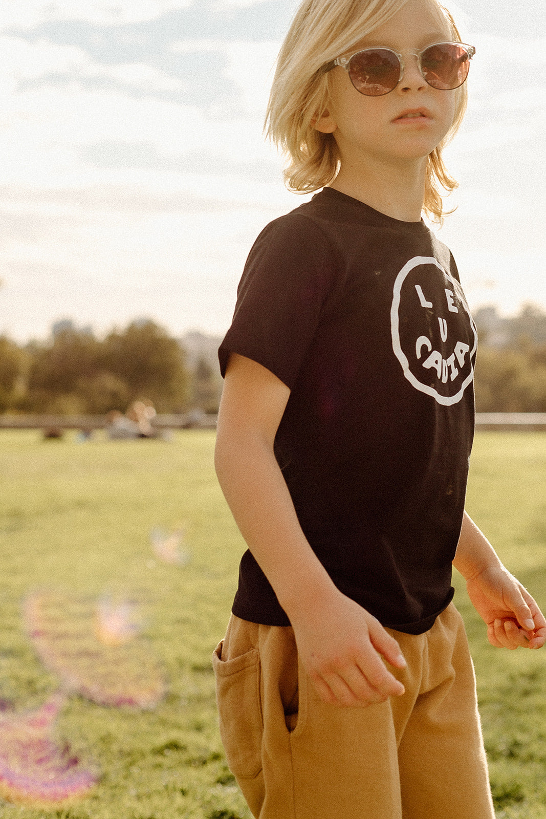 A fun little organic kids tee with a super cute little Leucadia smiley face by local artist Zach Smith. Printed on an organic cotton, fair trade tee with all proceeds to San Diego area families facing housing insecurity. Keep it funky, keep it kind, keep it local.