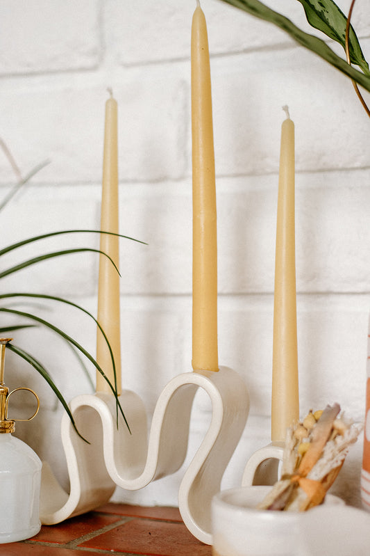 Meet Wyat: A stoneware candelabra with indulgent waves that support candlelight glow for every joyous dance party or intimate conversation over dinner. Handmade in Brooklyn, NY.