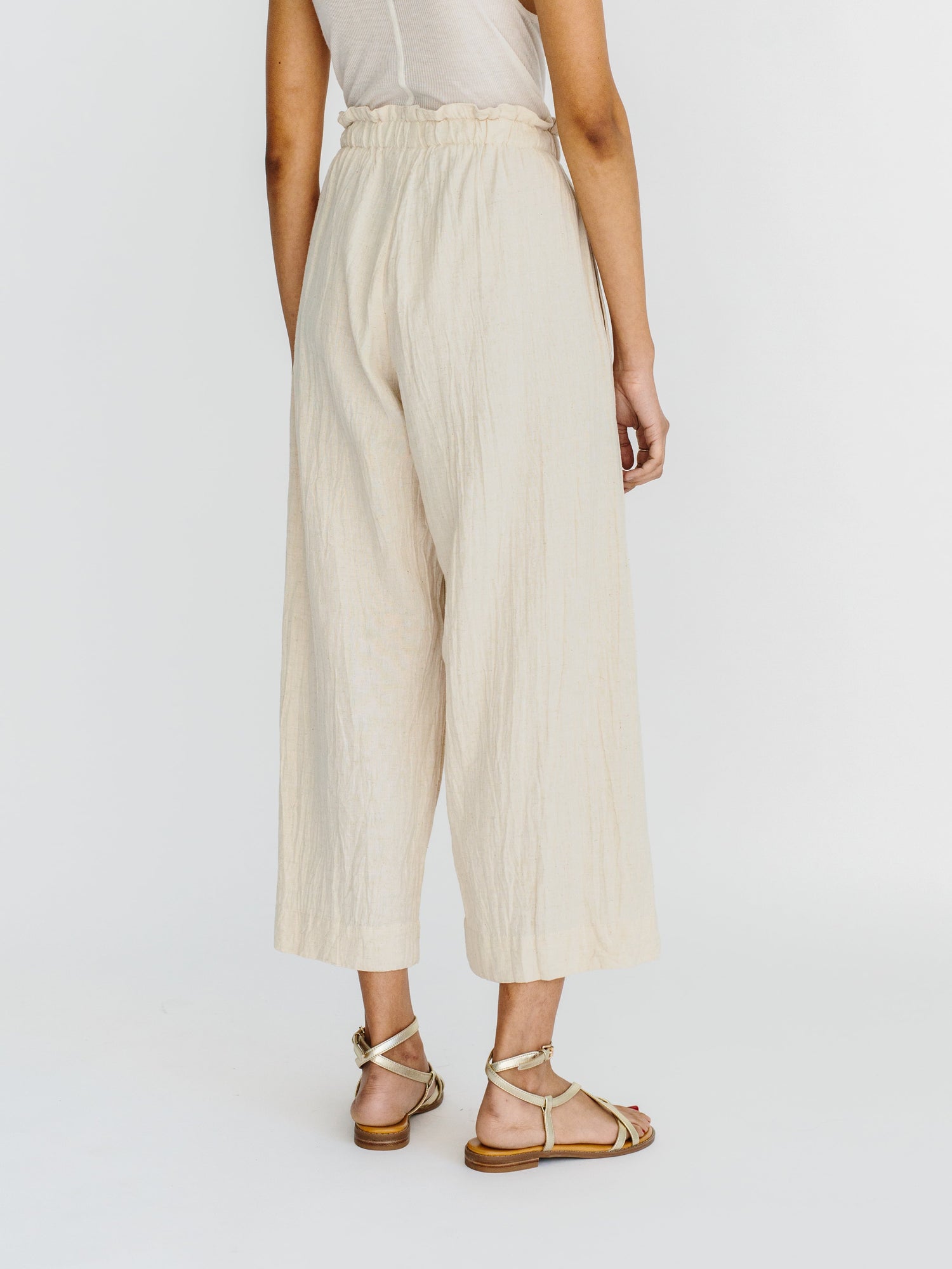 This paperbag waist pant is comfy, roomy, high waisted and wide legged. Wear it seaside with a swimsuit or with your favorite blouse tucked in. Ethically made in India.