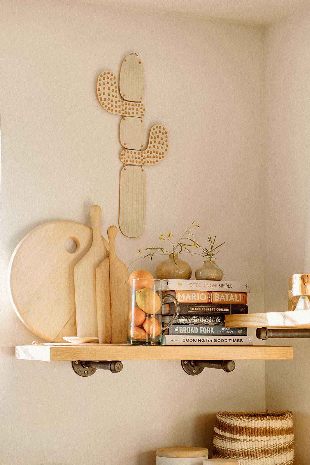 Large, circular hand-crafted serving or charcuterie board perfect for a display of cheese or appetizers. Ready to hang and display in your kitchen or any home space. Made sustainably from maple wood in Gatineau, Canada.