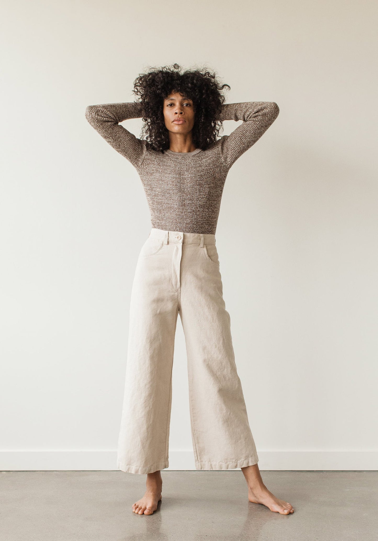 The new easy, everyday, go with anything trouser. Designed with a flattering high rise that is fitted through the hips and opens to a comfortable wide leg opening. Cut from an OEKO Tex Certified linen/cotton blend canvas twill, equal parts structure and comfort. First Rite sold at Thread Spun.