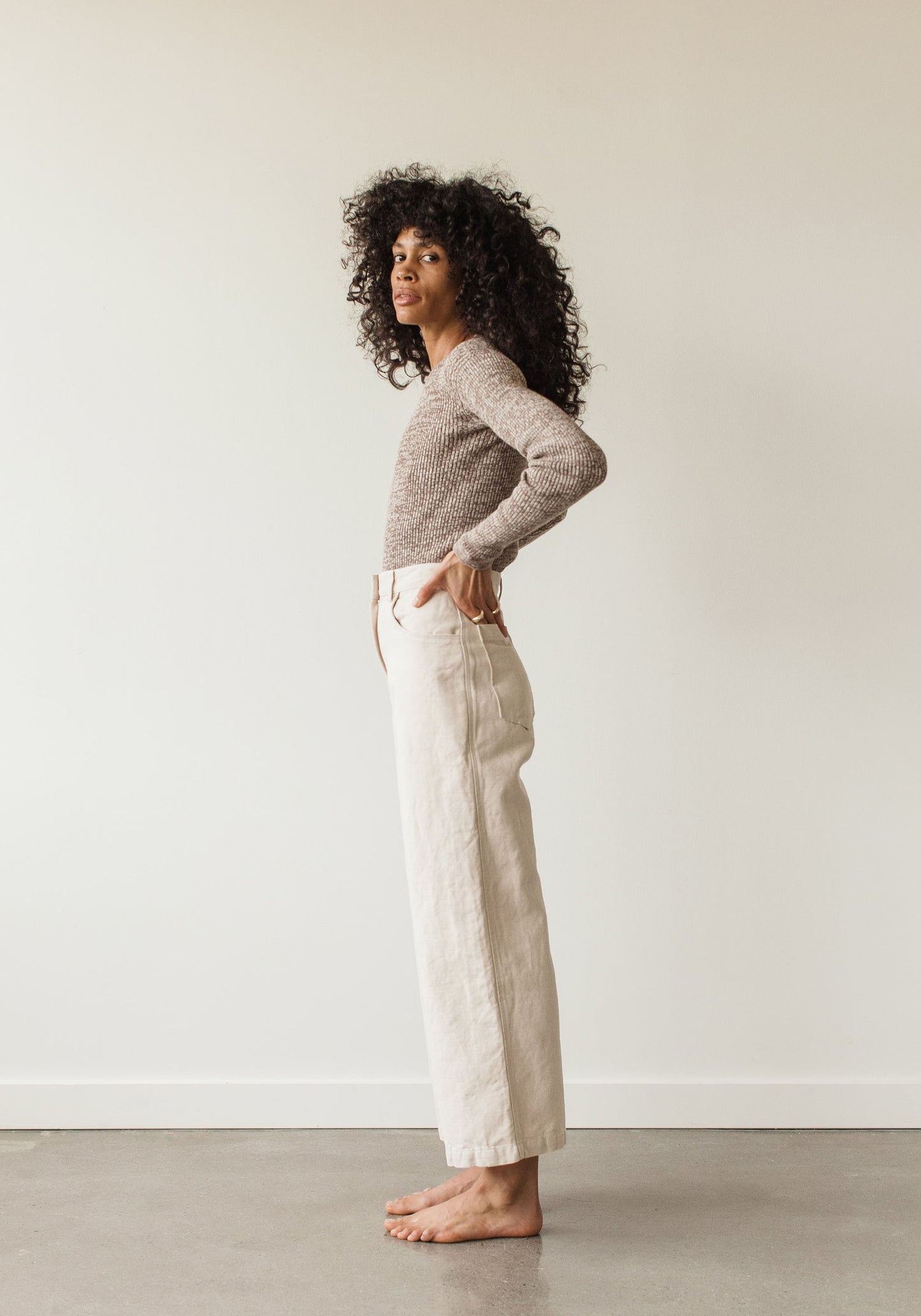 The new easy, everyday, go with anything trouser. Designed with a flattering high rise that is fitted through the hips and opens to a comfortable wide leg opening. Cut from an OEKO Tex Certified linen/cotton blend canvas twill, equal parts structure and comfort. First Rite sold at Thread Spun.