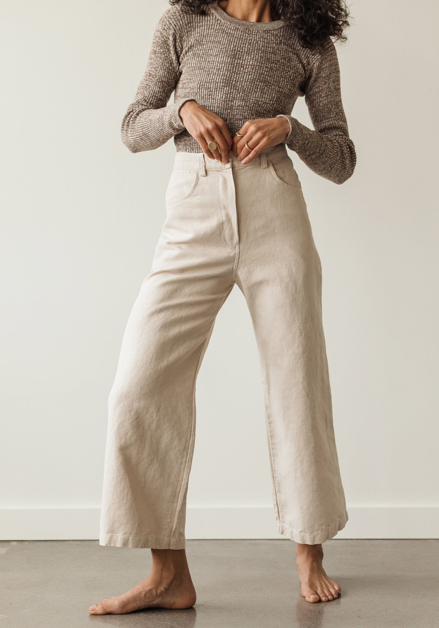 The new easy, everyday, go with anything trouser. Designed with a flattering high rise that is fitted through the hips and opens to a comfortable wide leg opening. Cut from an OEKO Tex Certified linen/cotton blend canvas twill, equal parts structure and comfort. First Rite sold at Thread Spun.