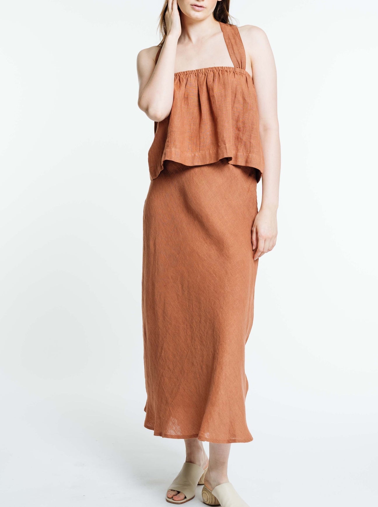 Jardin Midi Skirt: A vintage-inspired skirt with a subtle, feminine a-line shape and sweeping midi-length hemline met with a tailored waistband. Pair it with your favorite tanks and tops for a look that channels our favorite 90s fashion muses. Ethically made in India by Laude the Label.