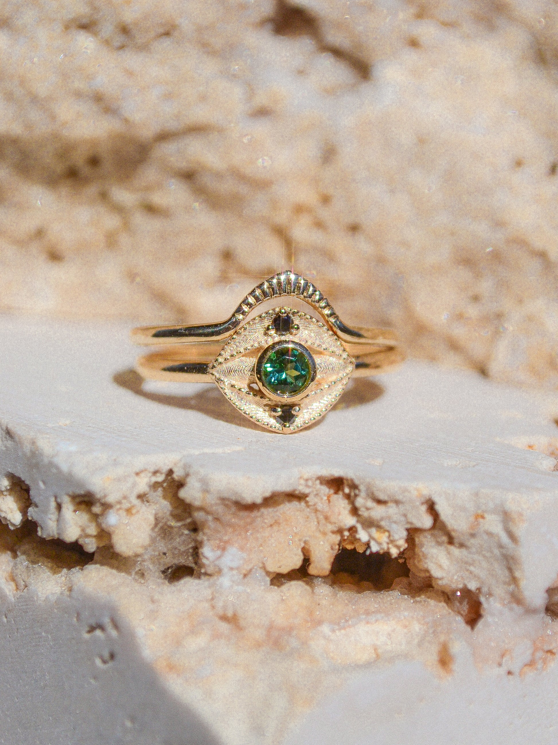 Blue green tourmaline encompassed in an eye shape of solid 14k yellow gold and 2 white diamonds. Inspired by an island in western Scotland. Each Miarante piece is carefully handcrafted in Chicago by a skilled production team.
