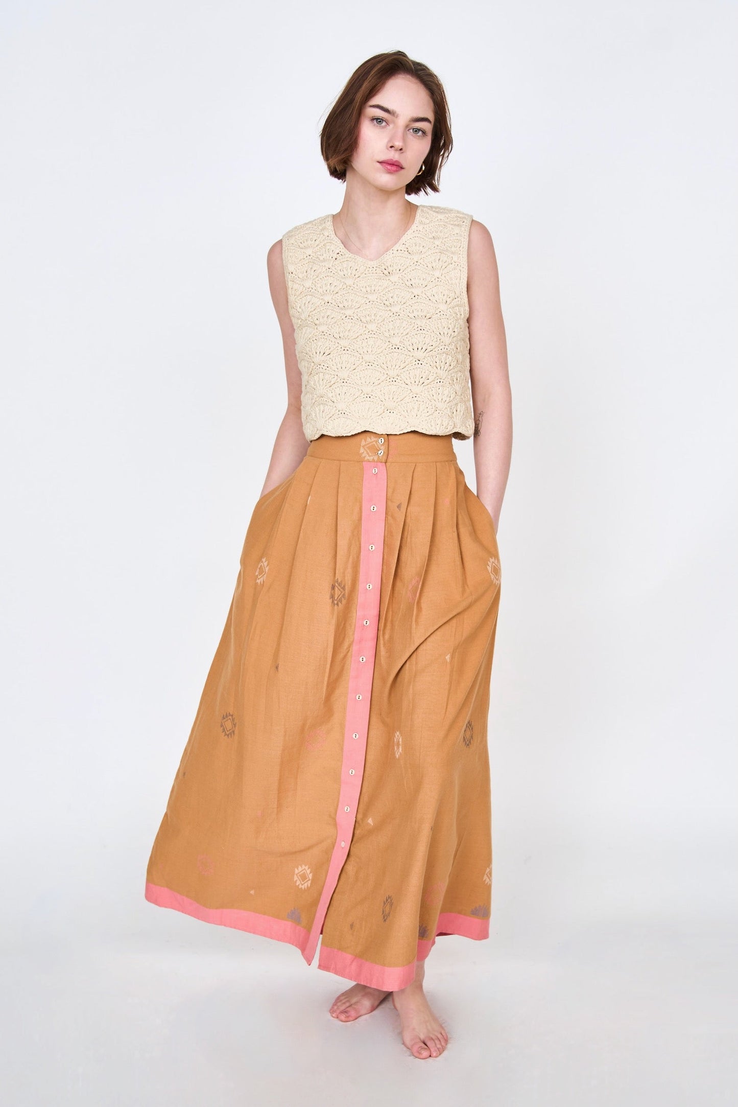 A statement maxi skirt for transitioning to warmer temps featuring jamdani, a weaving technique native to West Bengal. Ethically made with 100% cotton in India.