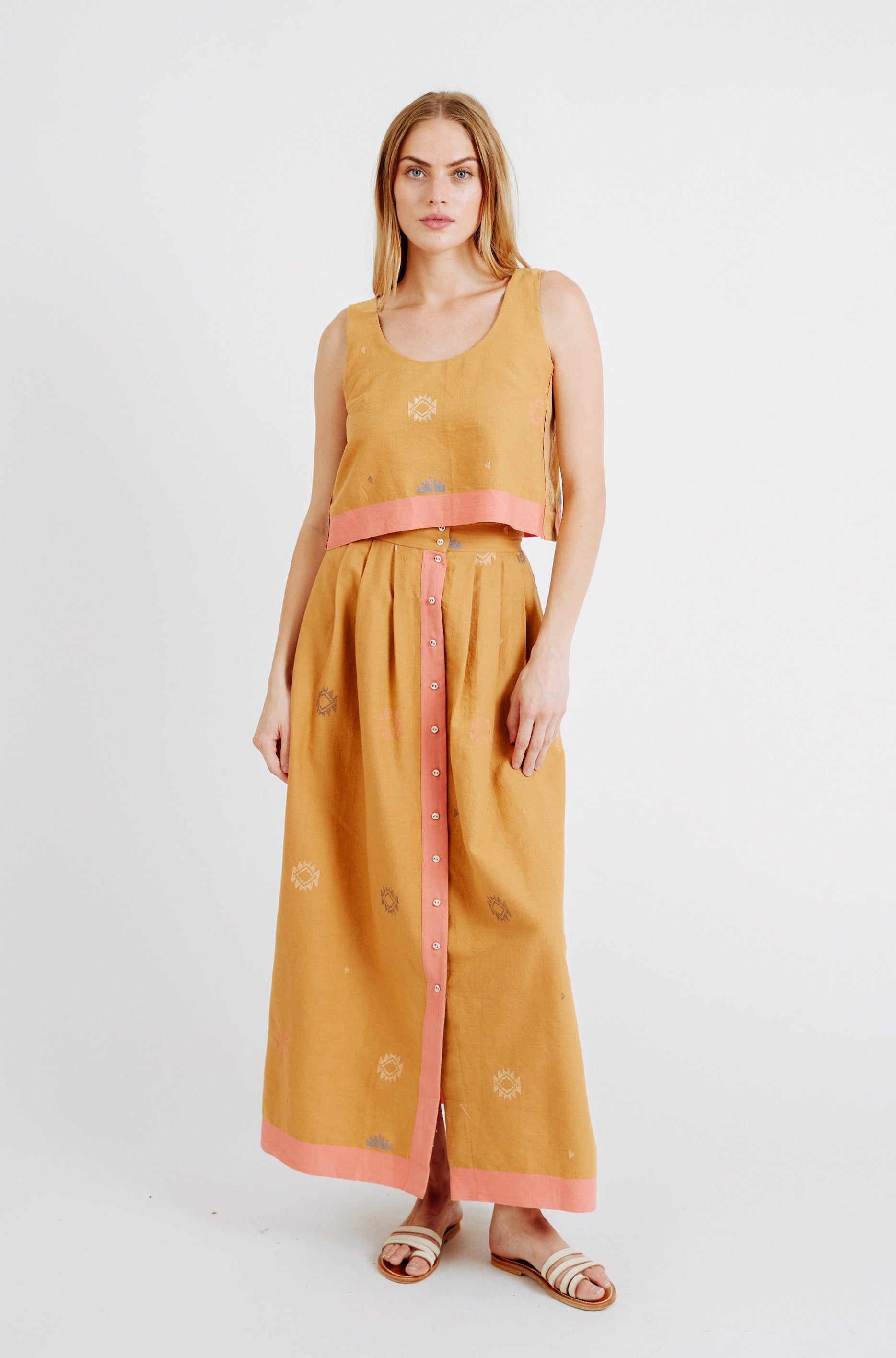 A statement maxi skirt for transitioning to warmer temps featuring jamdani, a weaving technique native to West Bengal. Ethically made with 100% cotton in India.