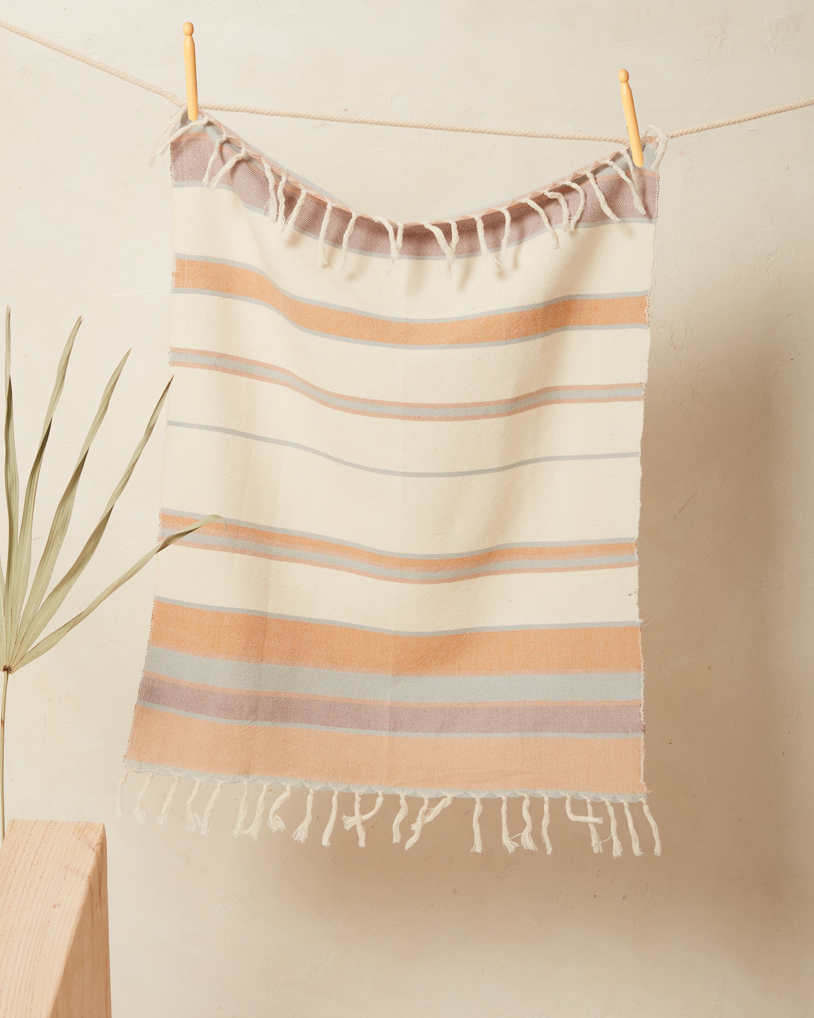 This tea towel is a classic yet modern addition to any kitchen or bathroom. Soft enough to function as hand towels, and durable enough to soak up spills around the kitchen. You can also use them as a centerpiece of a coffee or dining table. Finished with a rustic edge and fringe. Handwoven in Oaxaca, Mexico.