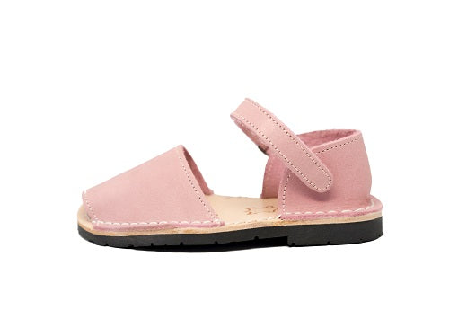 Quick to become your favorite pair to slip on your kids feet, these sandals can go with any outfit and go anywhere, anytime! Lovingly handcrafted by local artisans from Menorca, Spain with all natural high quality leather. Kids Pons Sandals in Light Pink.
