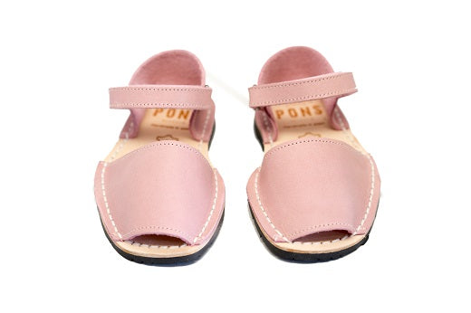 Quick to become your favorite pair to slip on your kids feet, these sandals can go with any outfit and go anywhere, anytime! Lovingly handcrafted by local artisans from Menorca, Spain with all natural high quality leather.  Kids Pons Sandals in Light Pink.