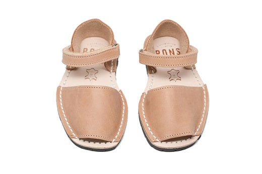 Quick to become your favorite pair to slip on your kids feet, these sandals can go with any outfit and go anywhere, anytime! Lovingly handcrafted by local artisans from Menorca, Spain with all natural high quality leather.  Kids Pons Sandals in Tan.