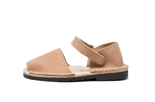 Quick to become your favorite pair to slip on your kids feet, these sandals can go with any outfit and go anywhere, anytime! Lovingly handcrafted by local artisans from Menorca, Spain with all natural high quality leather.  Kids Pons Sandals in Tan.