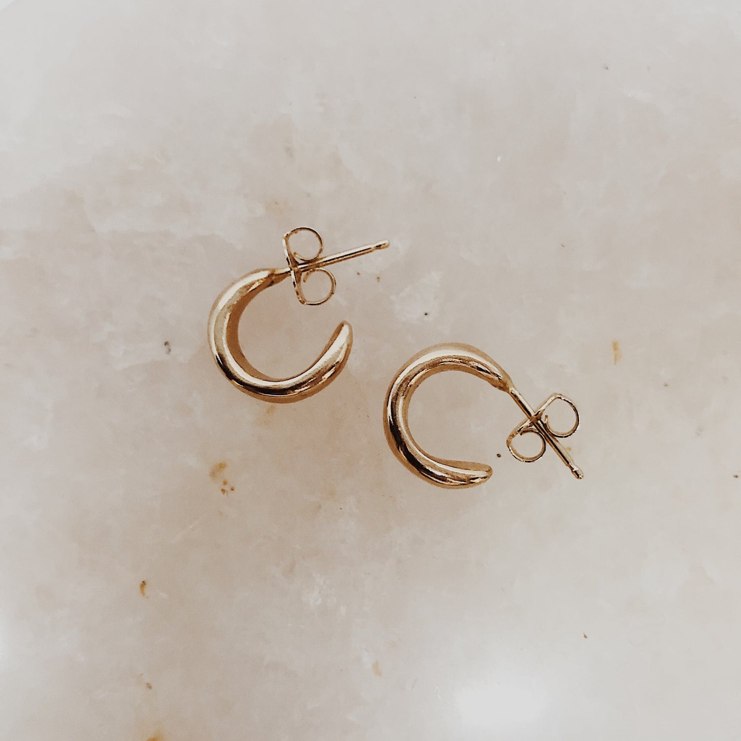 Organic and understated hoops with a luxurious feel.  The Cocoon Hoops hug the earlobe just perfectly.  Details:  hand cast in bronze or sterling silver 1 cm across sterling silver posts + backs