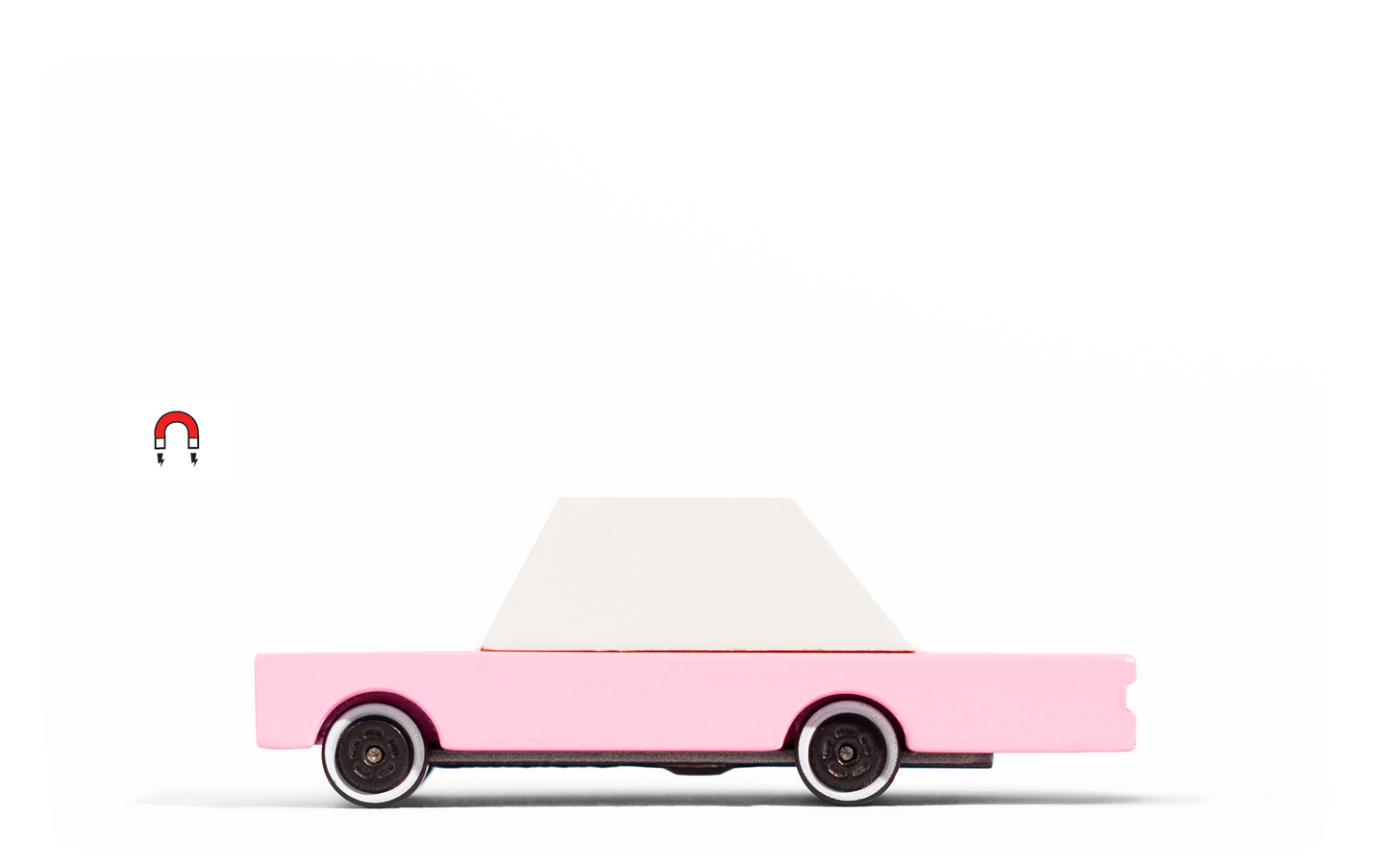 Pink Sedan toy car by Candylab Toys features solid beech wood and water-based paints. Made sustainably, made to last, made for fun. Wood, soy inks, water-based paints, degradable rubber, and metal parts are all part of Candylab's old school way of making toys, with a modern design twist.