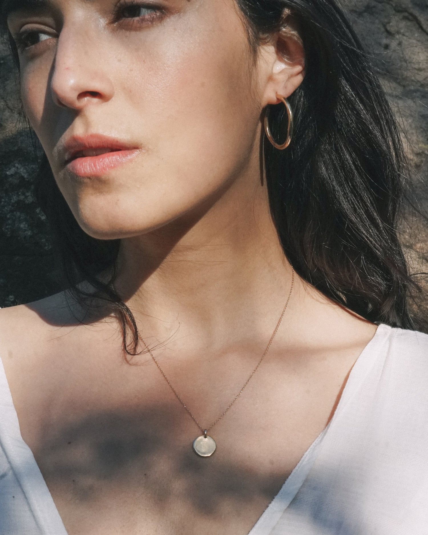 A classic everyday medallion necklace. Simple and feminine with a fluid feel. Inspired by the artist Georgia O'Keeffe. 