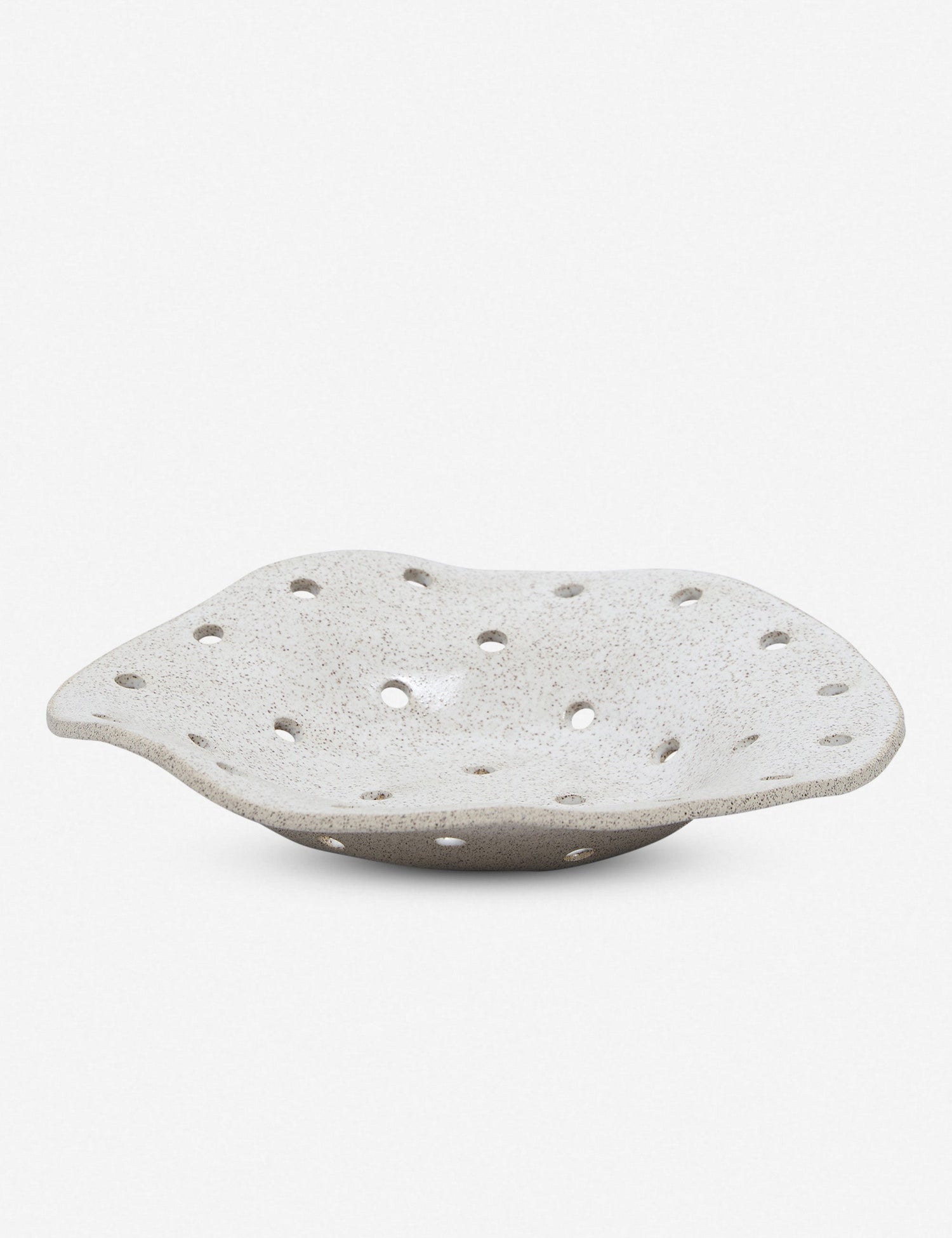 Virginia Sin's Bora berry bowl allows you to rinse and serve your berries in the very same bowl. Fun and functional, the perforated holes make for a graphic pattern that does the work of looking good and cleaning your berries, while it does. Handmade in Brooklyn, NY.