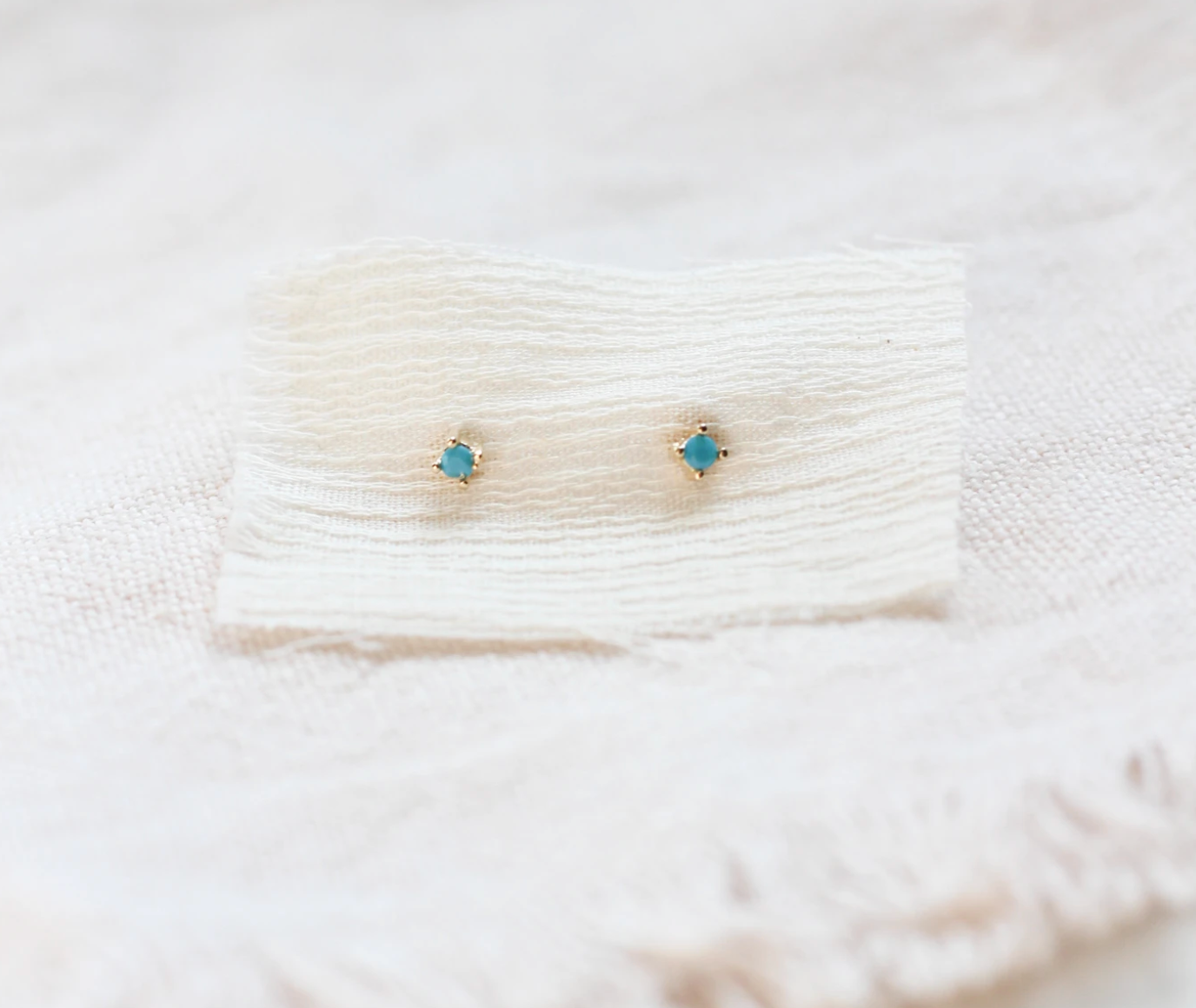 Stud earrings with vintage turquoise faceted stones. Made in sterling silver with a thick layer of 14k gold Vermeil. Handmade in the Santa Cruz Mountains.