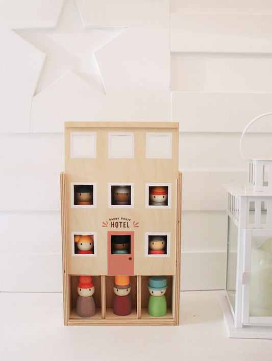 Happy folk hotel by Tenderleaf toys includes 9 wooden peg dolls and their hotel home