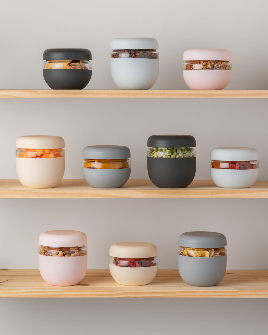 From soups to snacks, leak-proof your leftovers with this screw-top container. Crafted from durable borosilicate glass and wrapped in protective matte silicone, this eco-friendly alternative to plastic takeout containers is designed to encourage healthier everyday habits. BPA free and dishwasher and microwave safe.