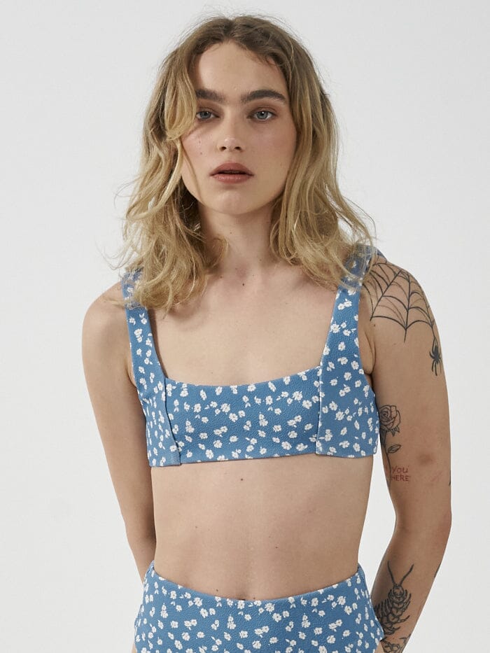 Made from eco-friendly recycled materials, the Aster Crop Bikini Top offers an eco-conscious choice without compromising on style, so you can feel just as good as you look! Designed in Byron Bay, Australia.