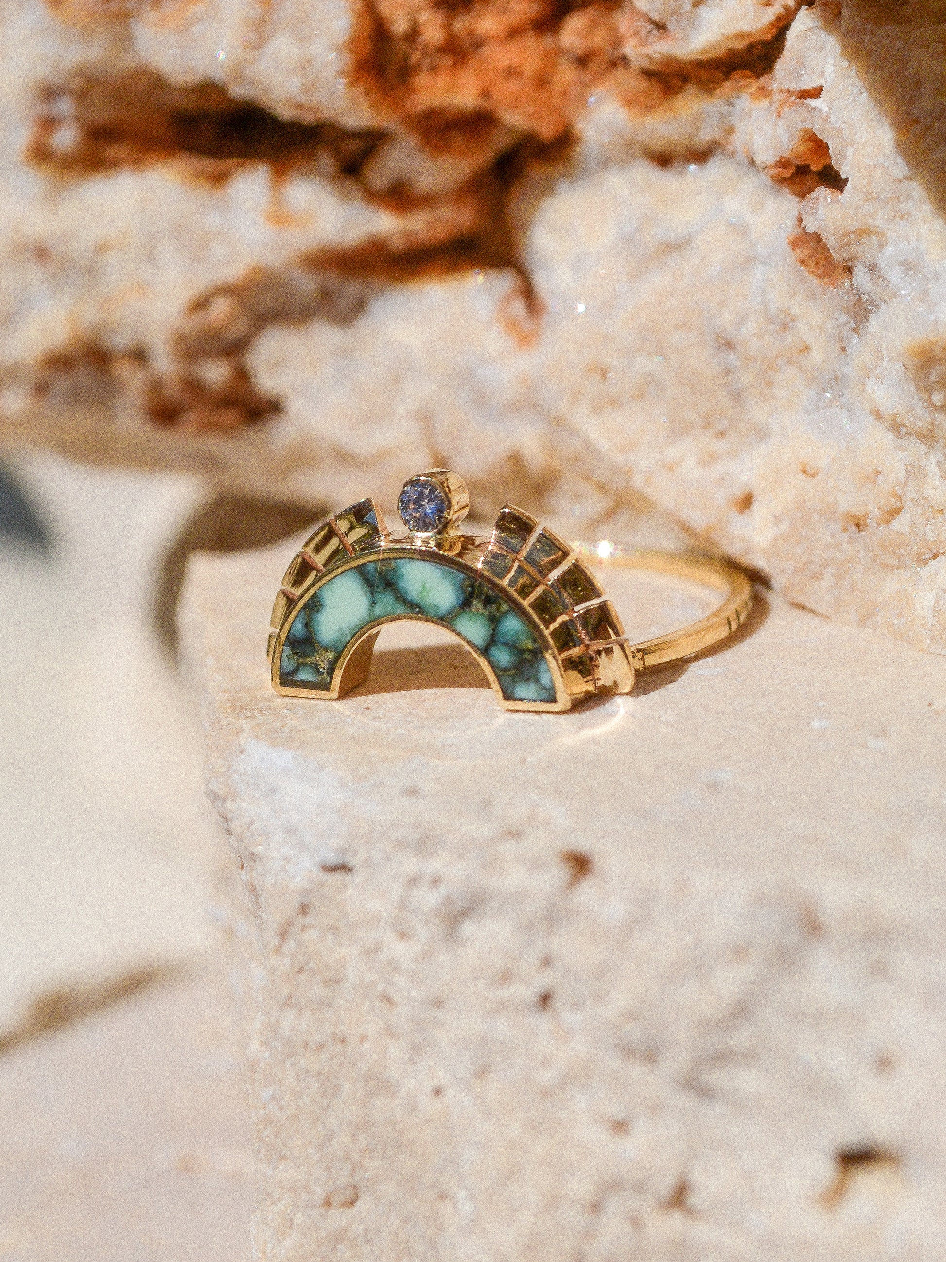 RISING SOL ARCH CROWN / The inlaid Angel Wing variscite is hand cut and shaped to fit perfectly inside this 14K gold bezel. A Young in the Mountain signature carved halo features a .03 ct conflict-free white diamond that brings beautiful light to this piece.