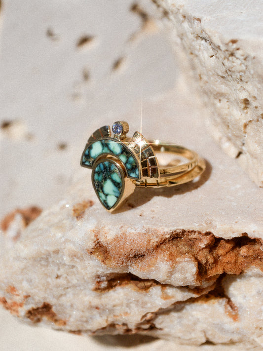 RISING SOL ARCH CROWN / The inlaid Angel Wing variscite is hand cut and shaped to fit perfectly inside this 14K gold bezel. A Young in the Mountain signature carved halo features a .03 ct conflict-free white diamond that brings beautiful light to this piece.