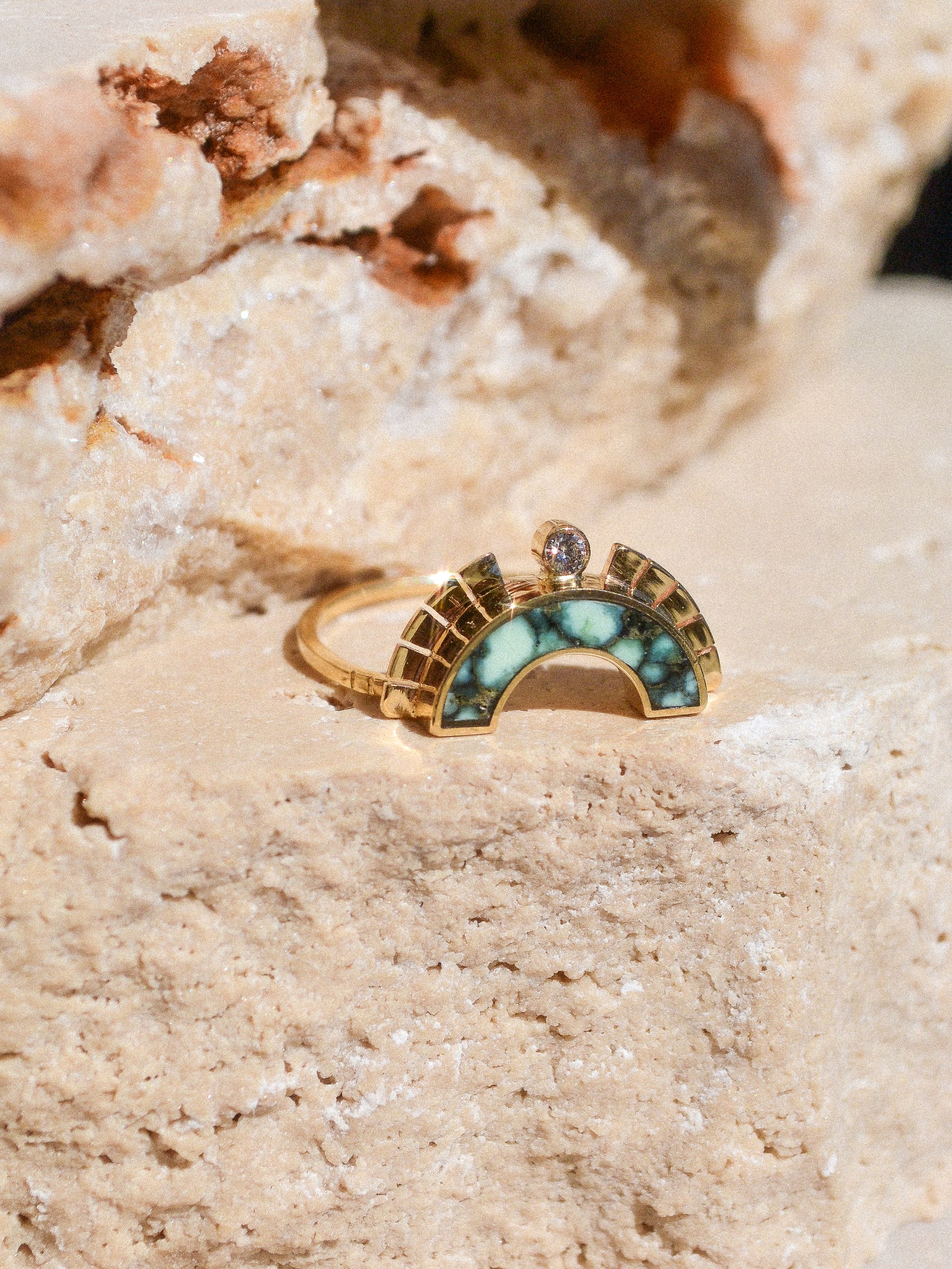 RISING SOL ARCH CROWN / The inlaid Angel Wing variscite is hand cut and shaped to fit perfectly inside this 14K gold bezel. A Young in the Mountain signature carved halo features a .03 ct conflict-free white diamond that brings beautiful light to this piece.