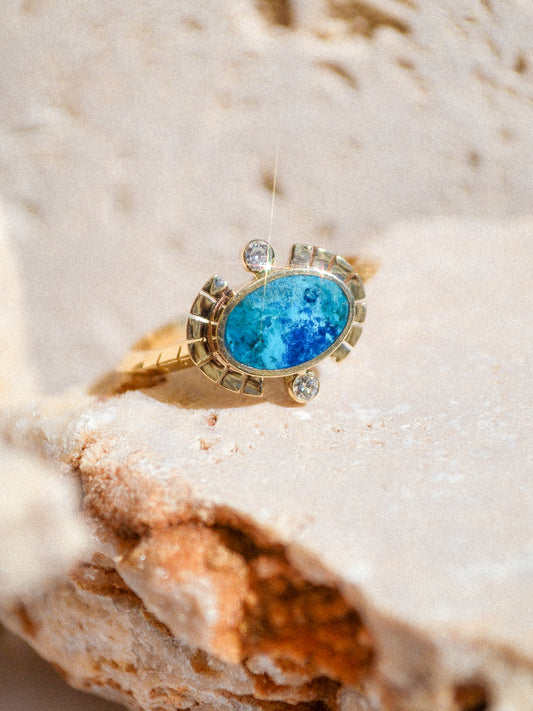 young in the mountains / The Sol Ring features inlaid shattuckite and is a beautiful and classic Young in the Mountains style. The Sol ring features two .03 ct. reclaimed white diamonds bezel set in 14k gold at top and bottom with golden wings at each side