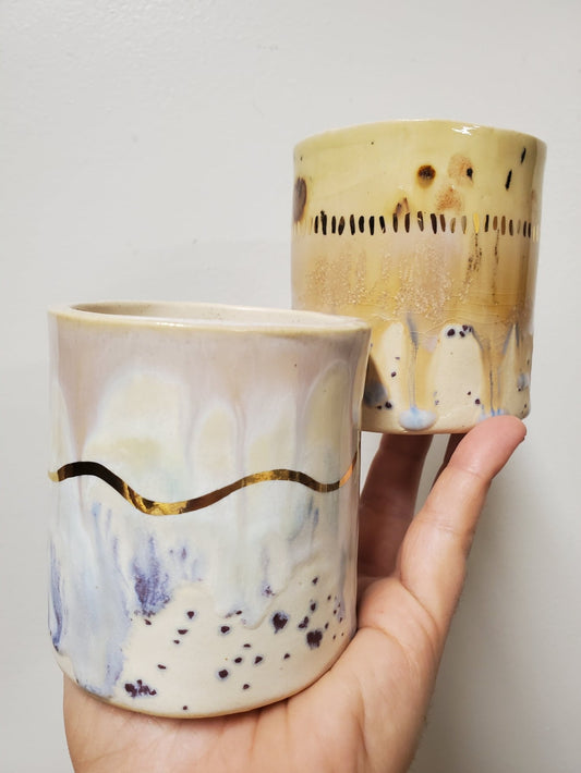 Handmade ceramic tumbler that is just perfect for all of your entertaining needs (including cocktails). Features gold luster accents for all of your celebrations and sure to impress.