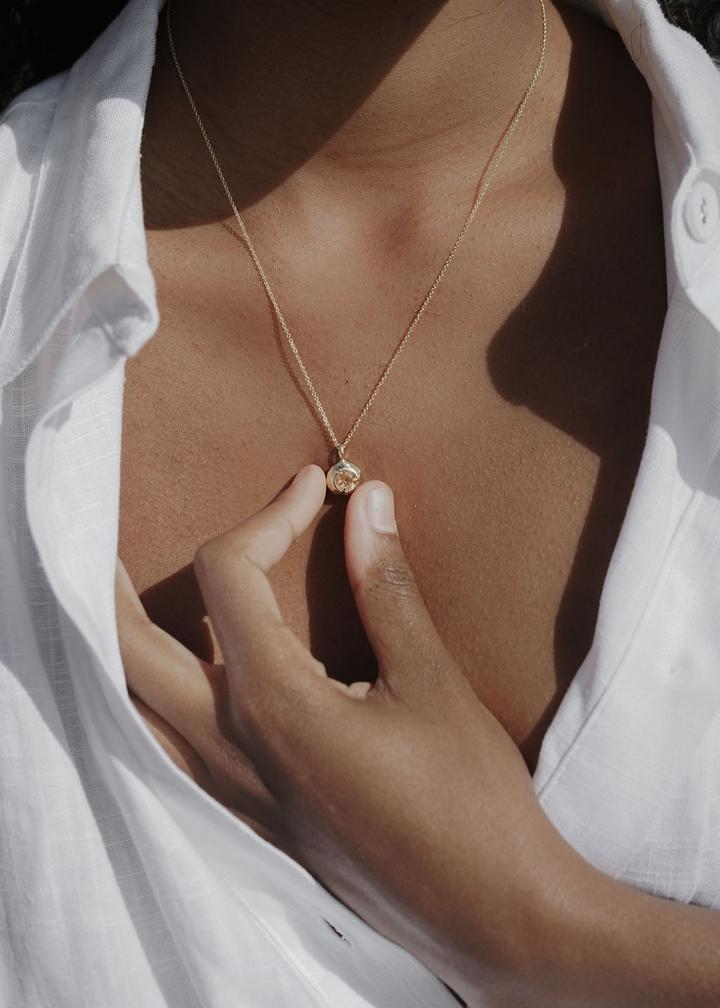 The Keeper Necklace is a quartz pendant necklace handmade in northern California by Amanda Hunt. Keep the energy of quartz close to your heart.