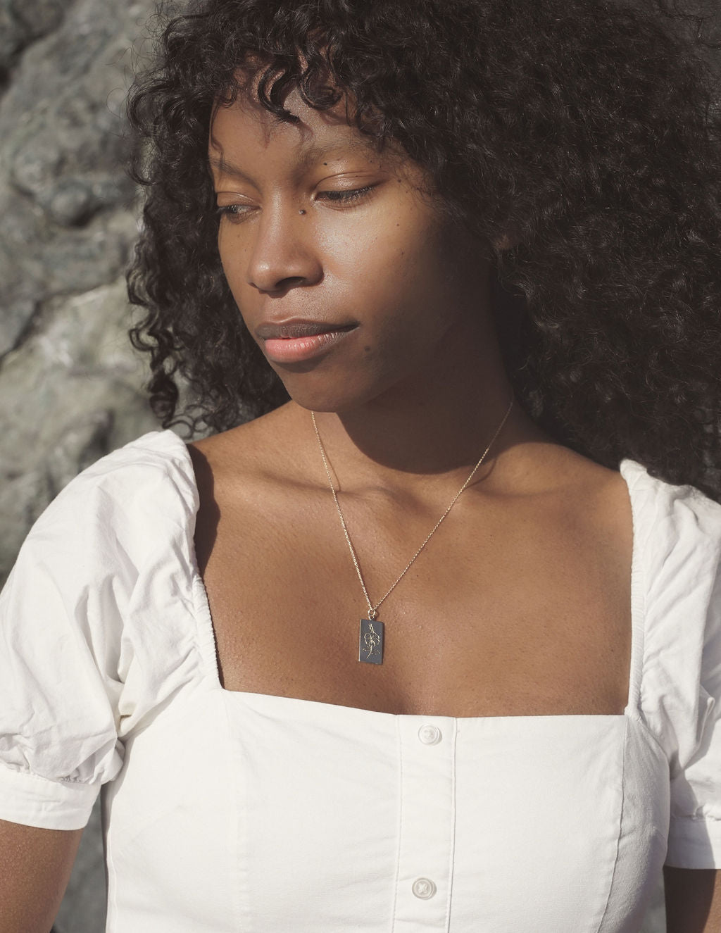 Handmade bronze tarot necklace featuring a wild rose. A tarot card from the plant world to adorn your neck. Hand carved in wax from original drawings by Arwyn Moonrise and sustainably made in northern California by Amanda Hunt.