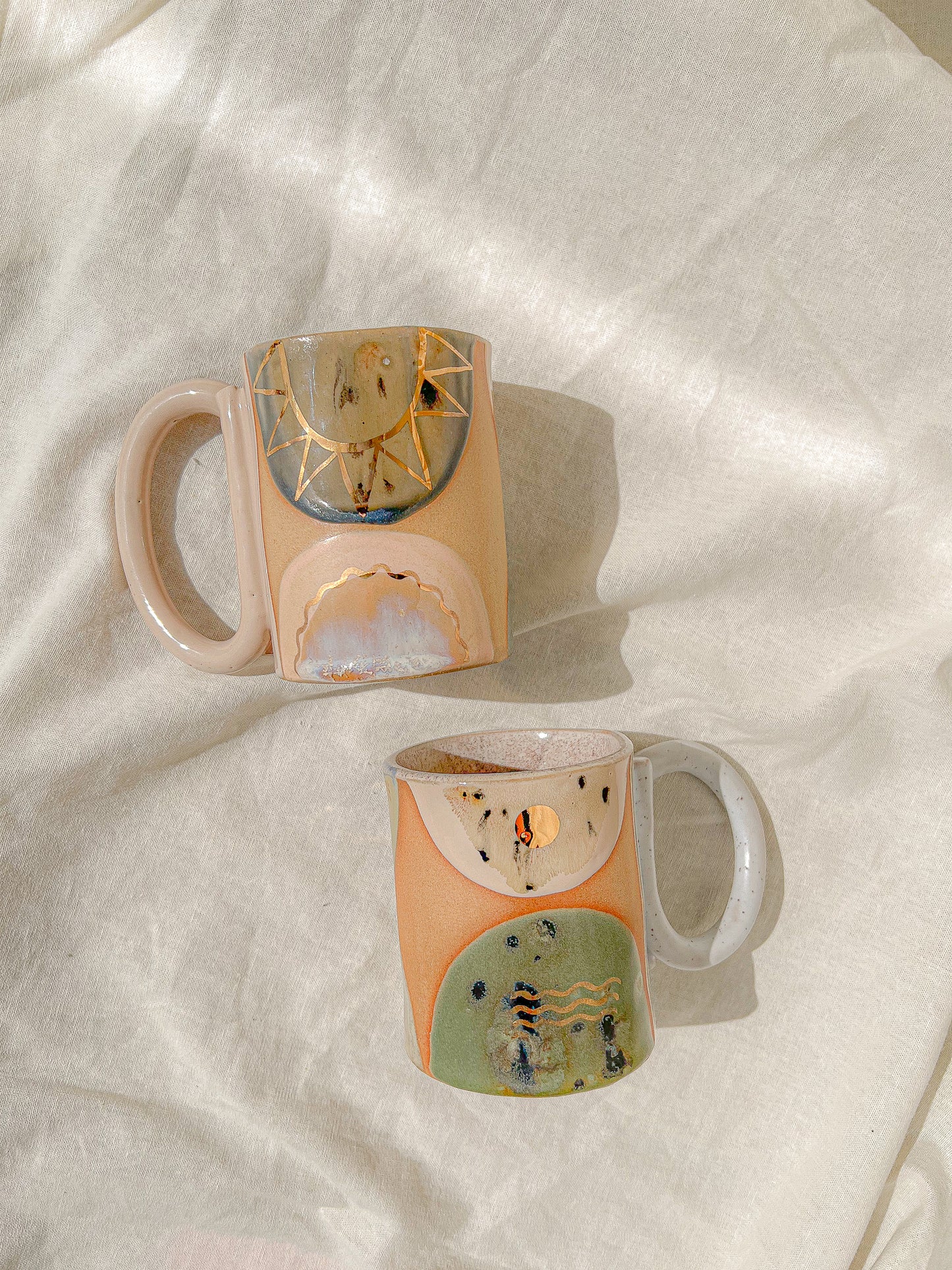 Handmade ceramic mug featuring unique glaze colors and a looped handle.