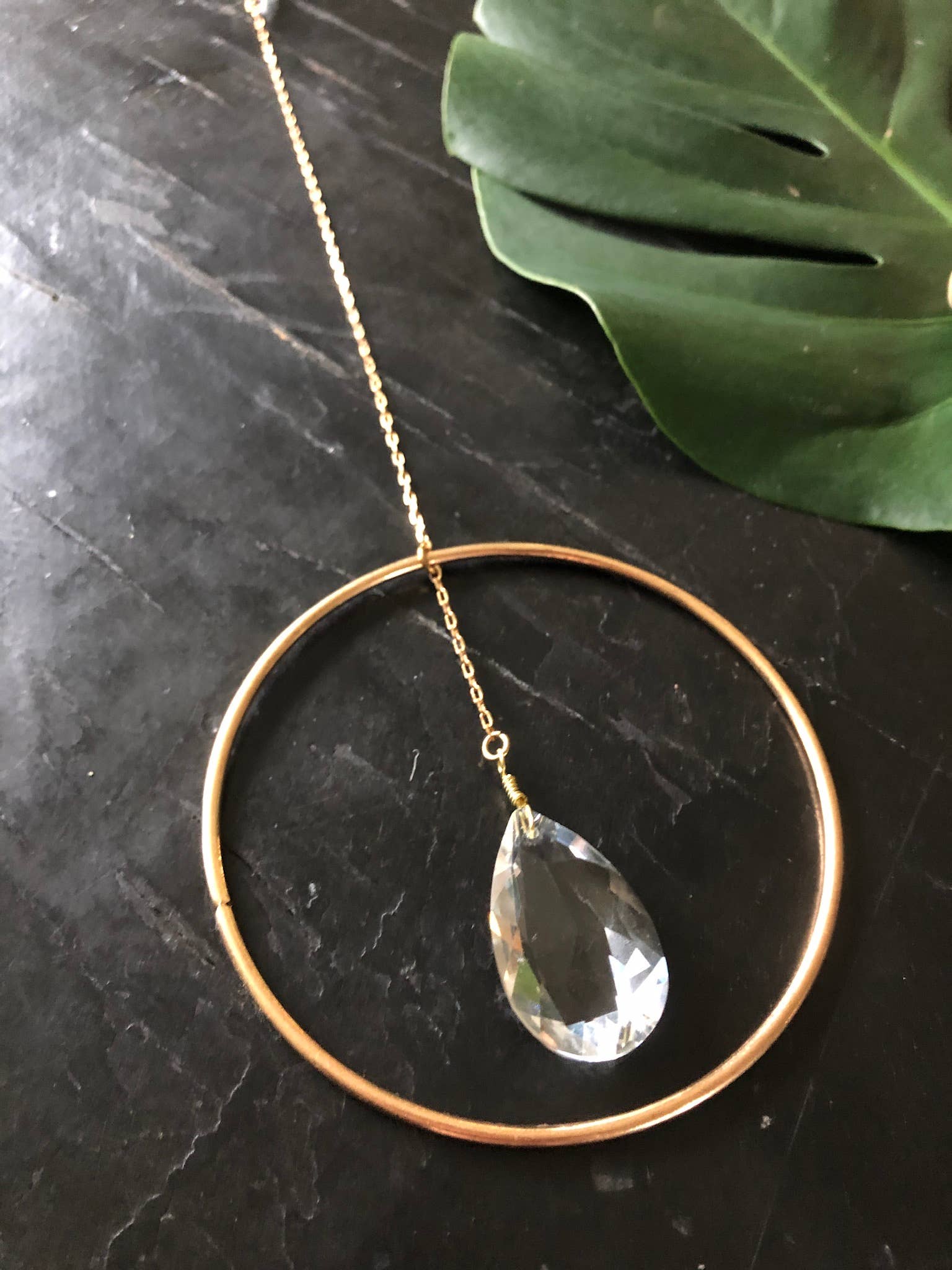 Artisan-crafted light catcher made from brass tubing and 2 vintage faceted crystals. Ready to hang in any space in your home - on a wall to brighten or in a window to catch the light.