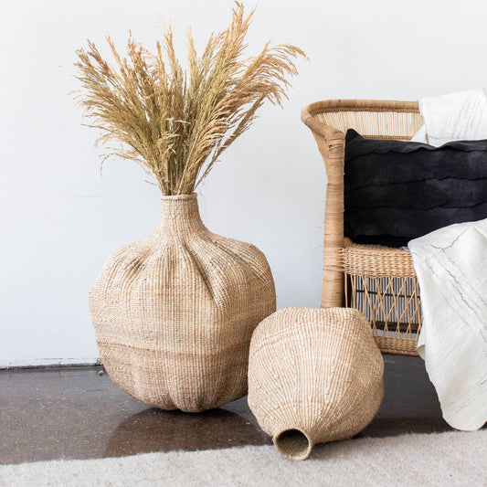 Handmade with the Ilala Palm, these one-of-a-kind baskets are handwoven in Zimbabwe. “Perfectly Imperfect” and organic in shape, no two are the same, and this natural variation draws attention from everyone who sees them. Beautiful when styled alone, or in a grouping, the possibilities are endless.