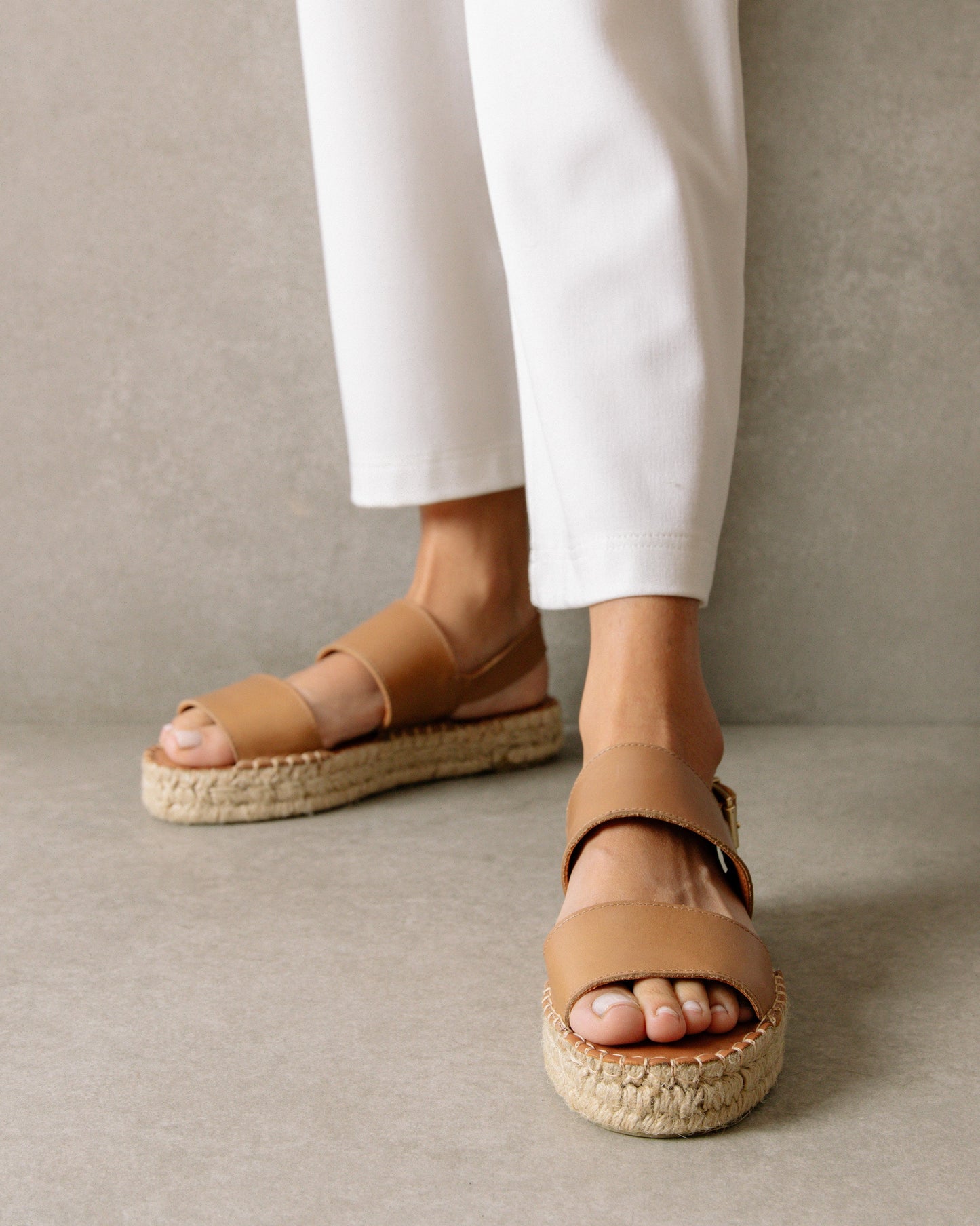 These double strap platform sandals boast two straight, wide straps with an ankle strap with buckle to adjust your desired fit. They also have an open toe so you can let your feet breathe in the summer heat. Sustainably made in Spain.