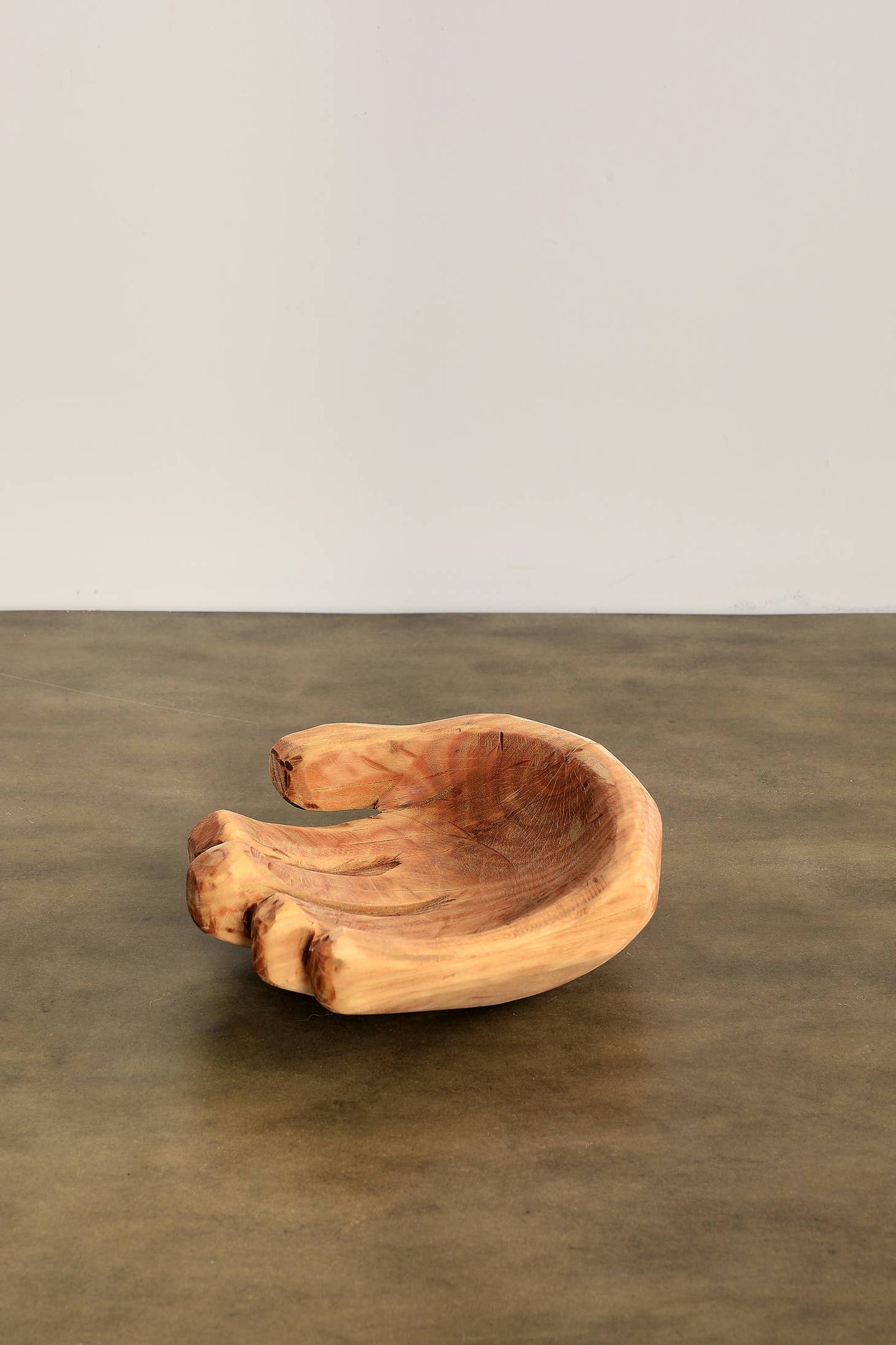 An elegant wood bowl hand-carved in South Africa from a single piece of sustainably sourced Blue Gum eucalyptus.