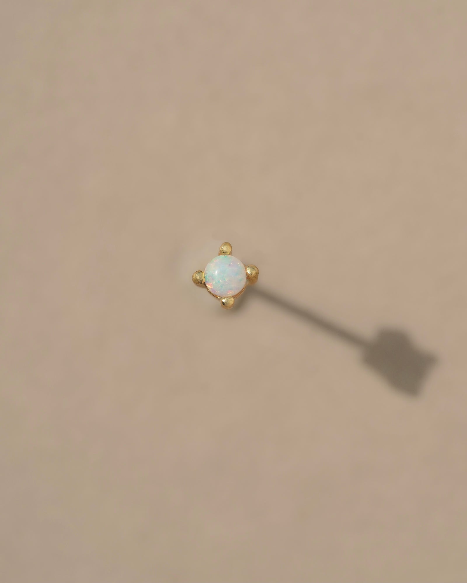 Tiny vibrant Australian Opals set in 14k gold vermeil prongs on sterling silver posts. Handmade in the Santa Cruz Mountains.