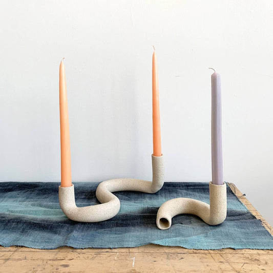 Hand-formed, stoneware taper candlestick holder to add dimension to your table scape. By Janelle Gramling.
