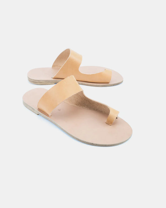Handmade Greek leather slip on sandals with a natural leather sole and either green or black leather straps. Made with vegetable tanned vachetta leather. Kyma's goal is to offer high end Greek leather sandals with minimalistic aesthetics, combining the classic with the modern.